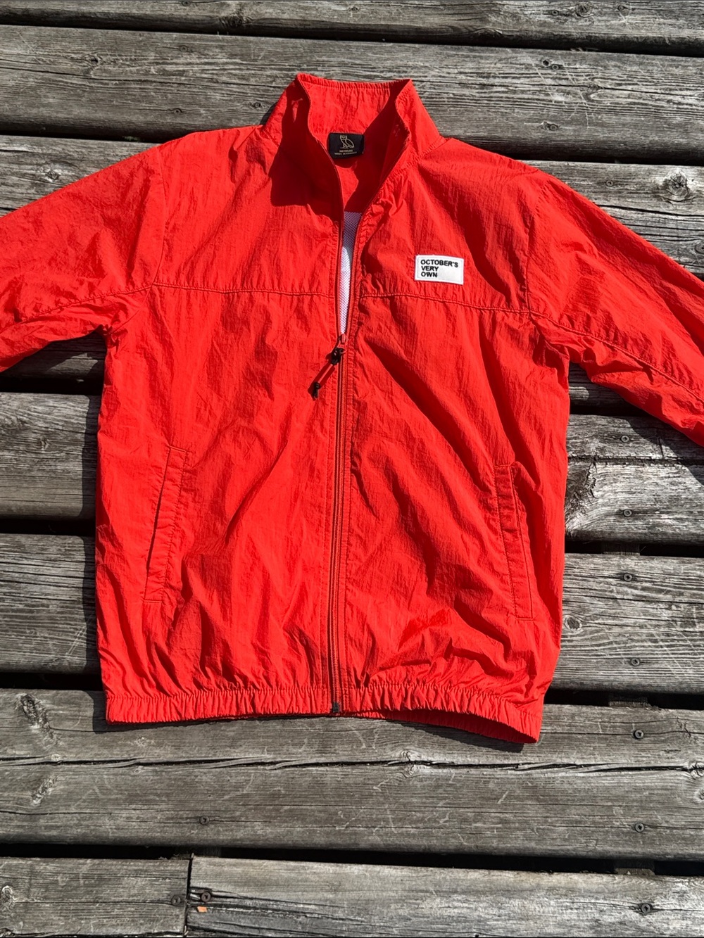 OVO October’s Very Own “Team October” Windbreaker Jacket in Deep Orange